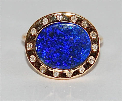 18kt Gold opal with flush diamond oval ring