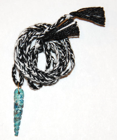 Plain turquoise twist shell pendant on bi color hand woven cord